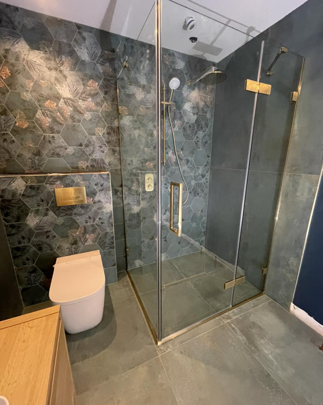 green hexagonal tiled wet room