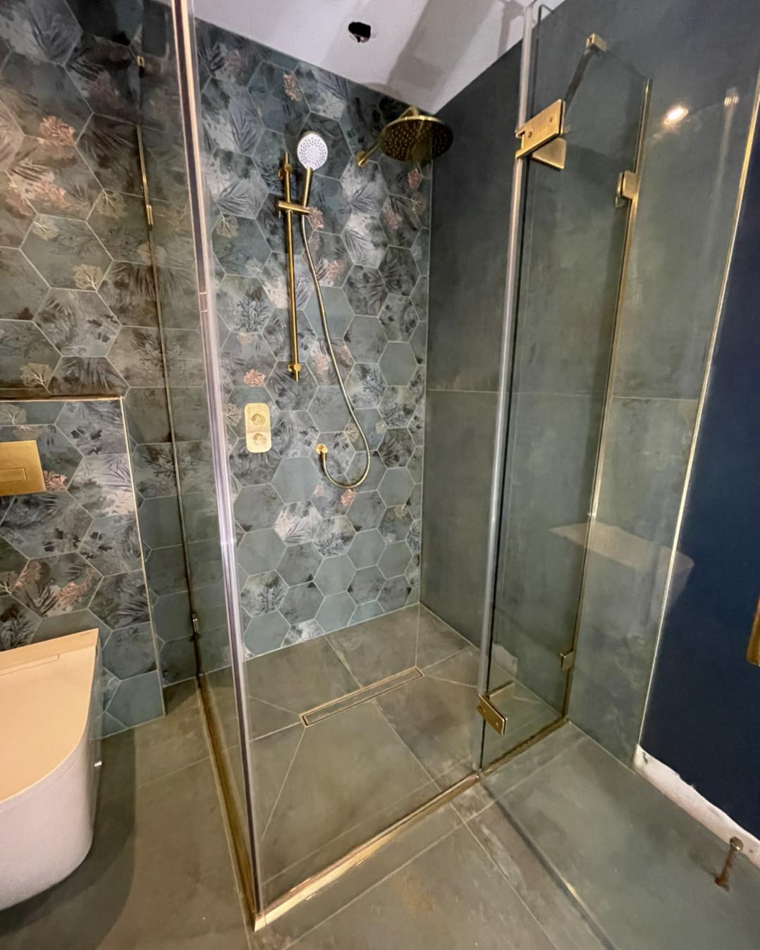 Gold hardware in a waterfall shower