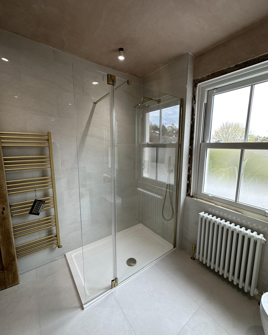 off white and gold bathroom