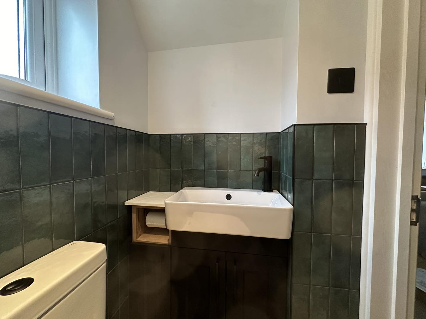 ceramic sink with black hardware