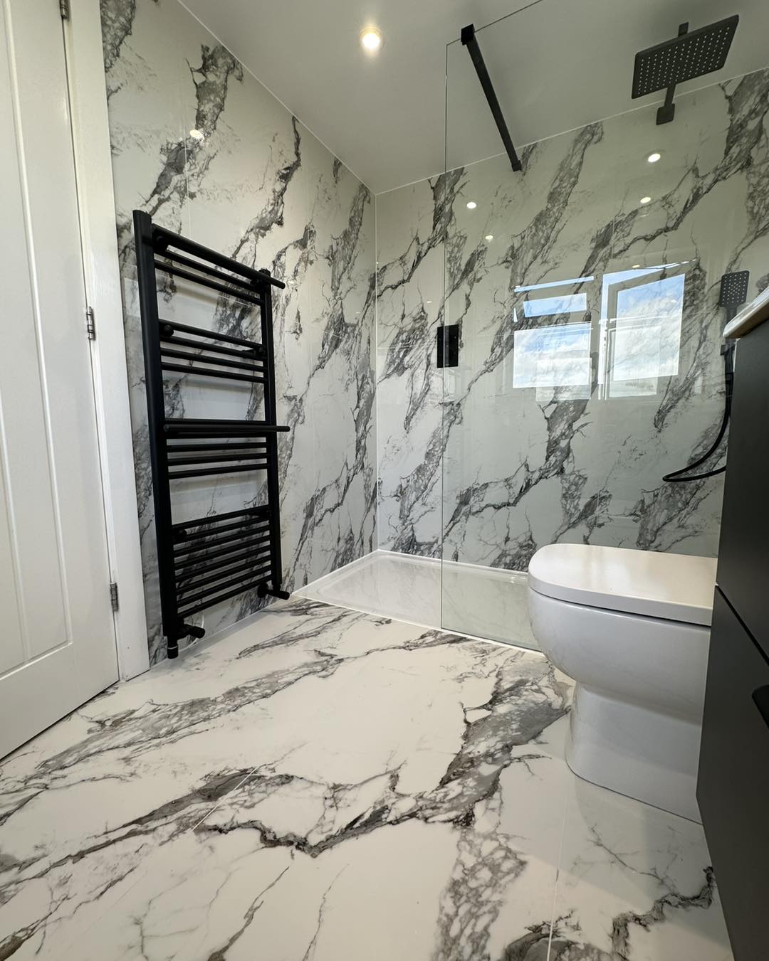 Marble bathroom with black hardware