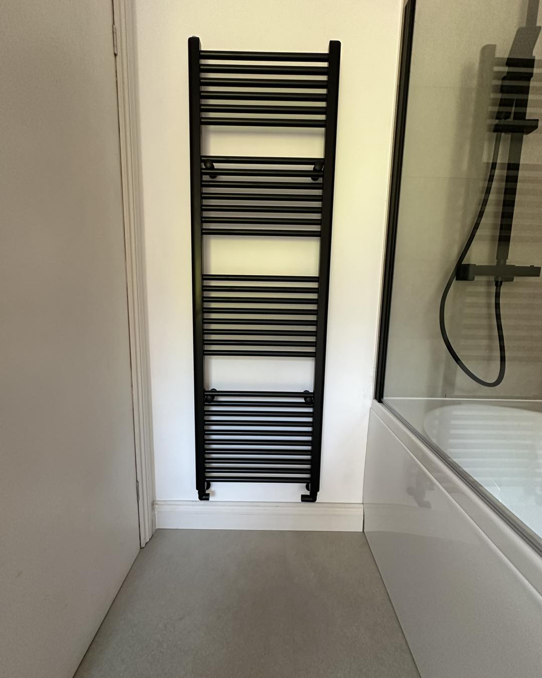 black radiator in a bathroom