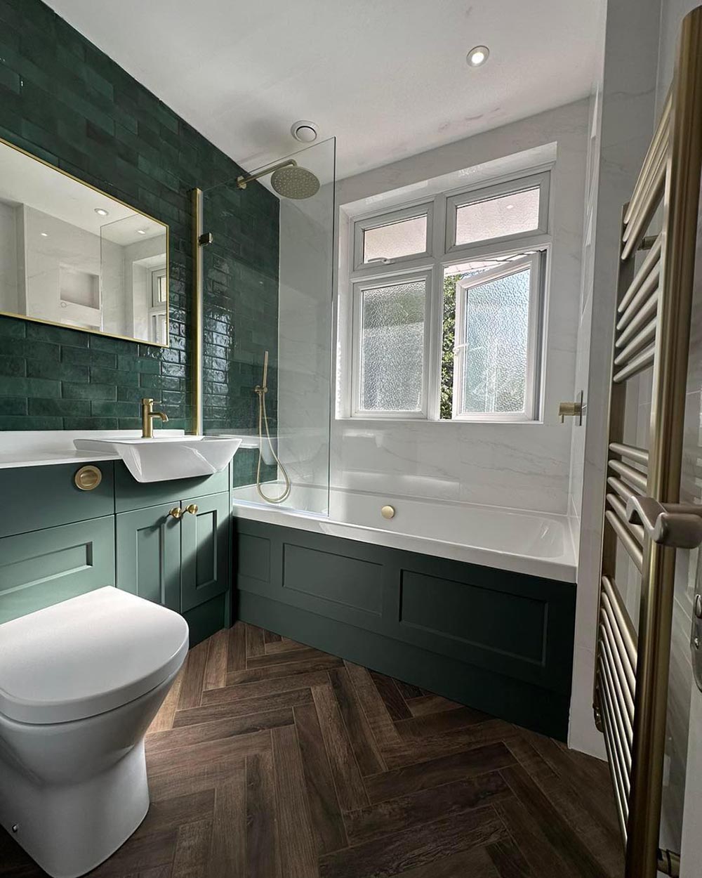 green bathroom furniture with gold hardware