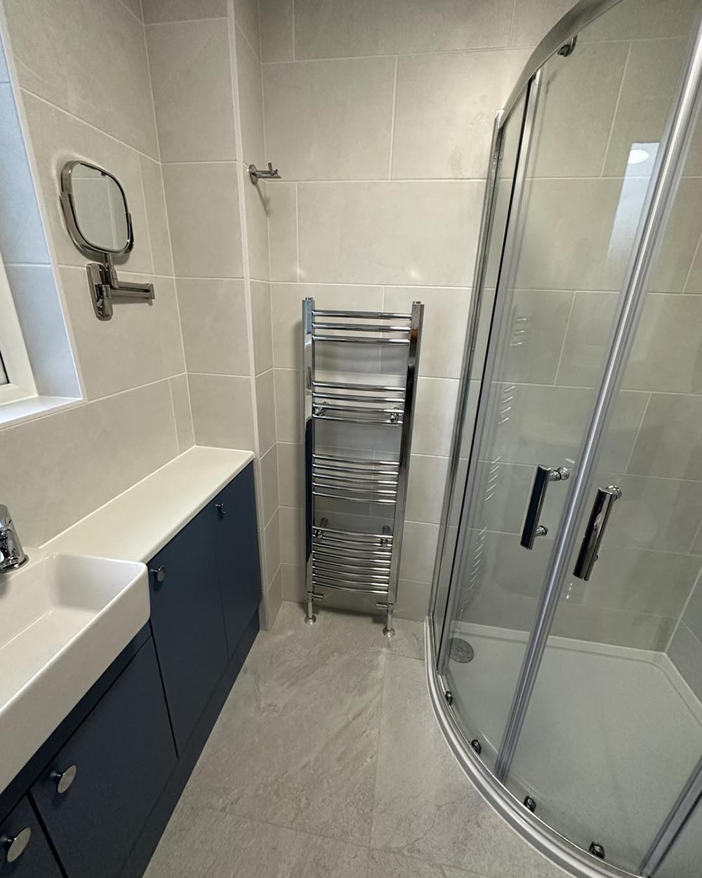 navy bathroom furniture with chrome hardware